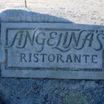 Restaurant logo sculpted in sand