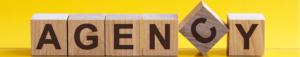 blocks spelling the word agency